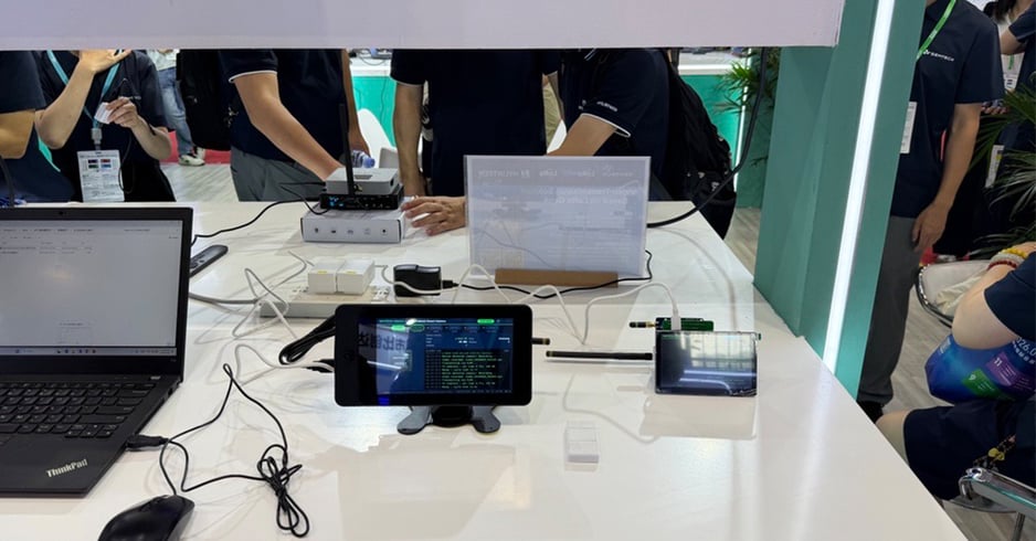 Laptop and handheld devices set up for a LoRa wireless data transfer demo at the Semtech booth