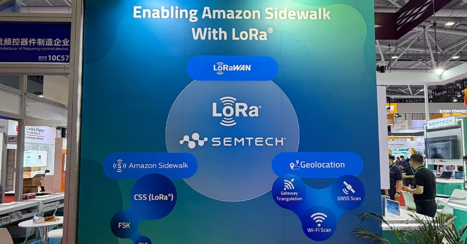 Booth signage showing how LoRa and LoRaWAN enable Amazon Sidewalk connectivity and geolocation